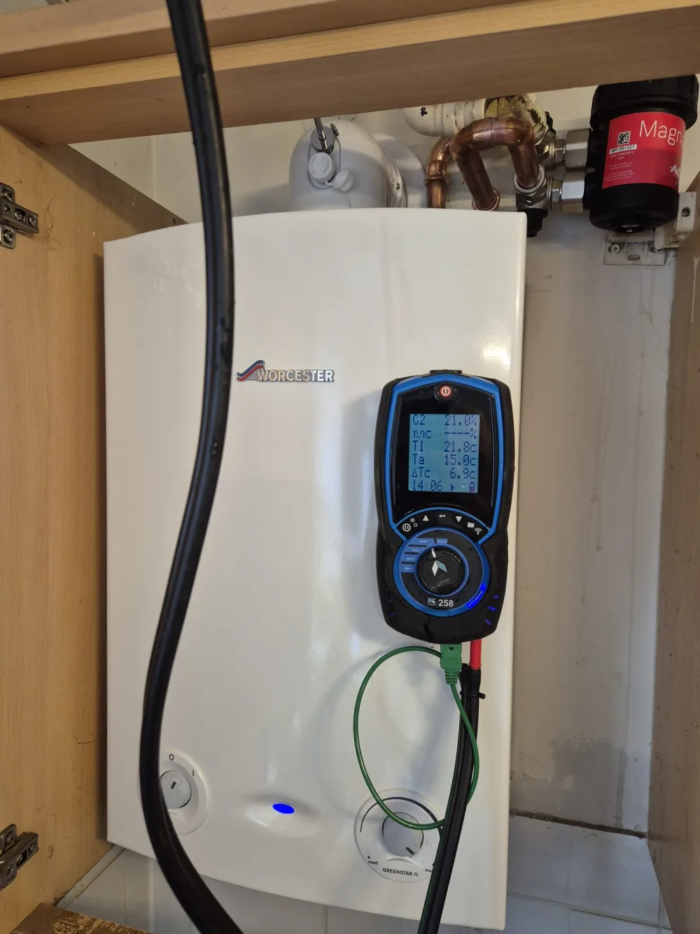 Close-up of test equipment connected to a domestic boiler