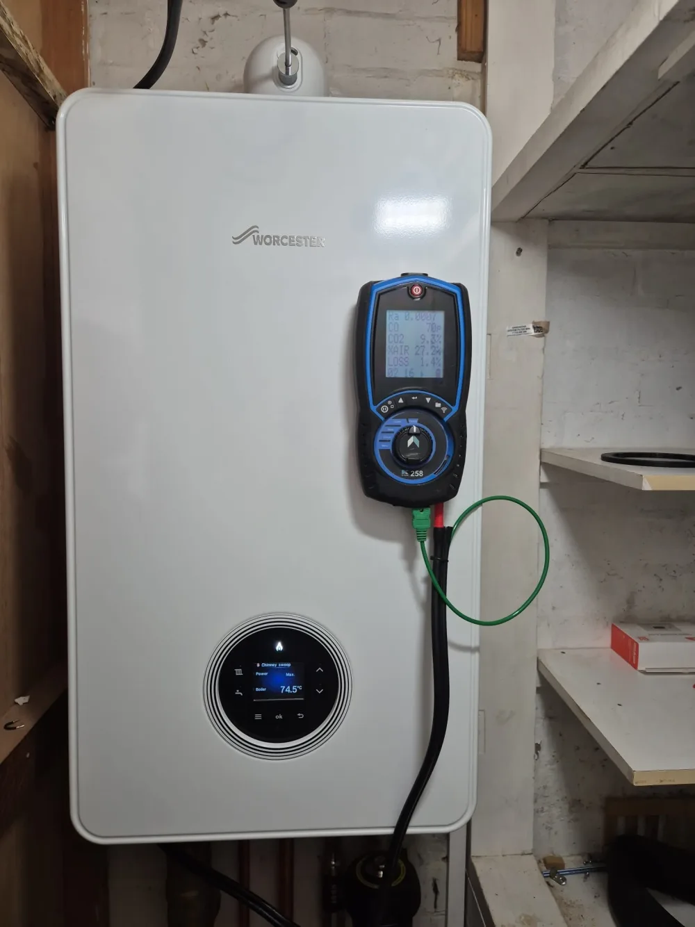 Test equipment connected to a wall-mounted domestic boiler