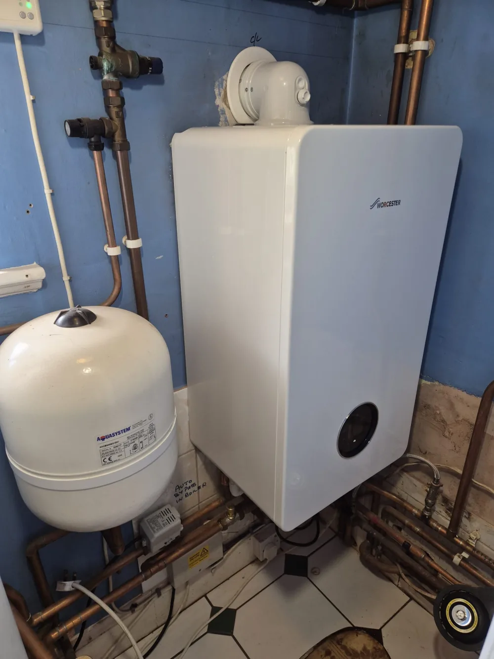 Wall-mounted boiler, expansion vessel and copper pipework